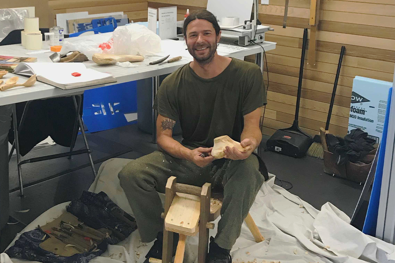 Travis Skinner carving in the hcma office.