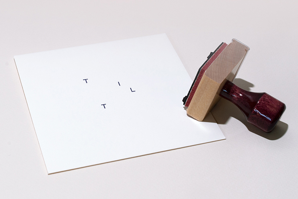 A custom TILT rubber stamp was made to brand a variety of TILT items, including envelopes.