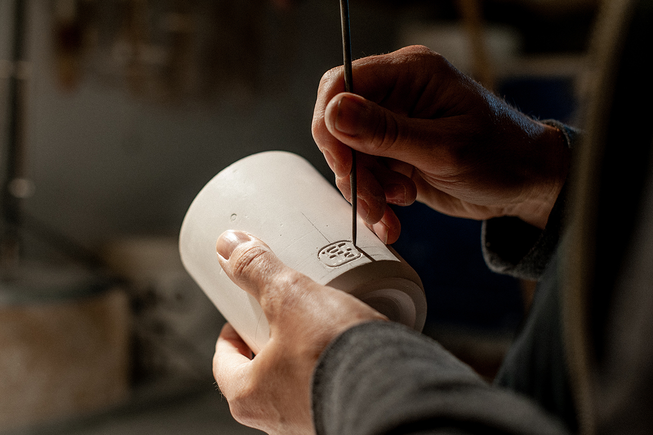 Russell Hackney carving the hcma logo into the master positive to make slip cast moulds.