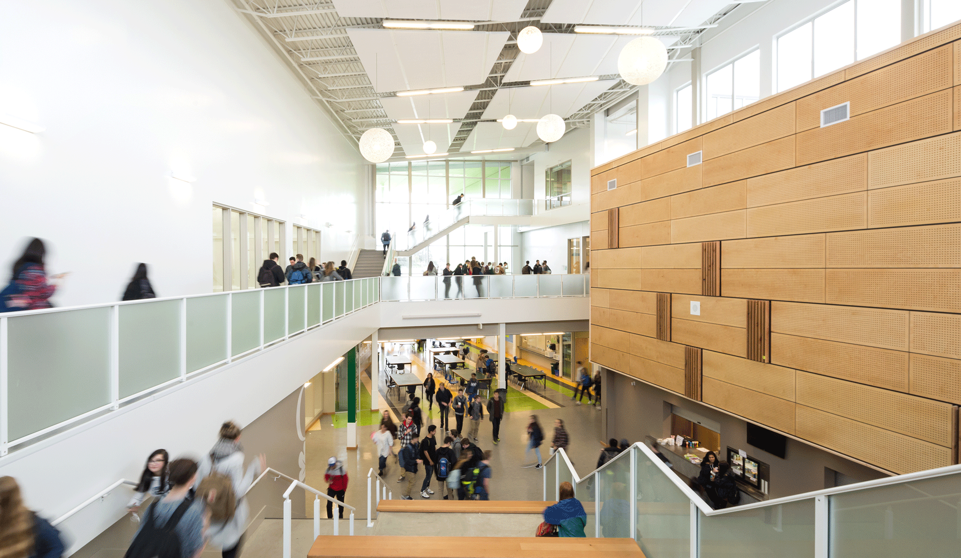 Students walking through school staircases and balconies