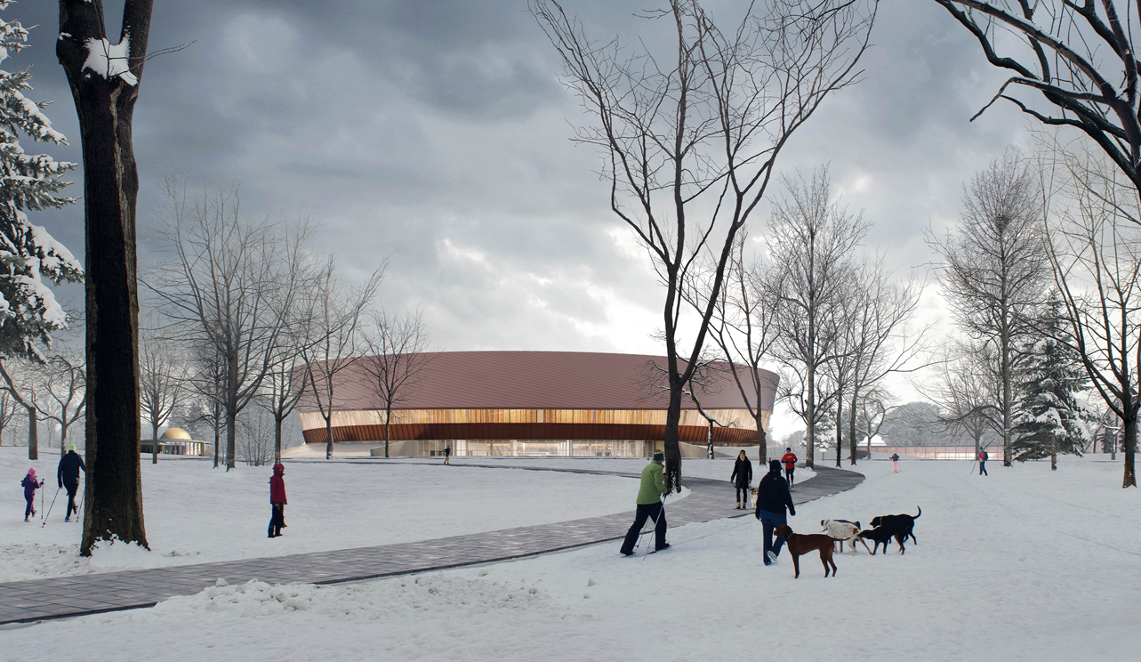 A round, copper coloured building surrounded by snow