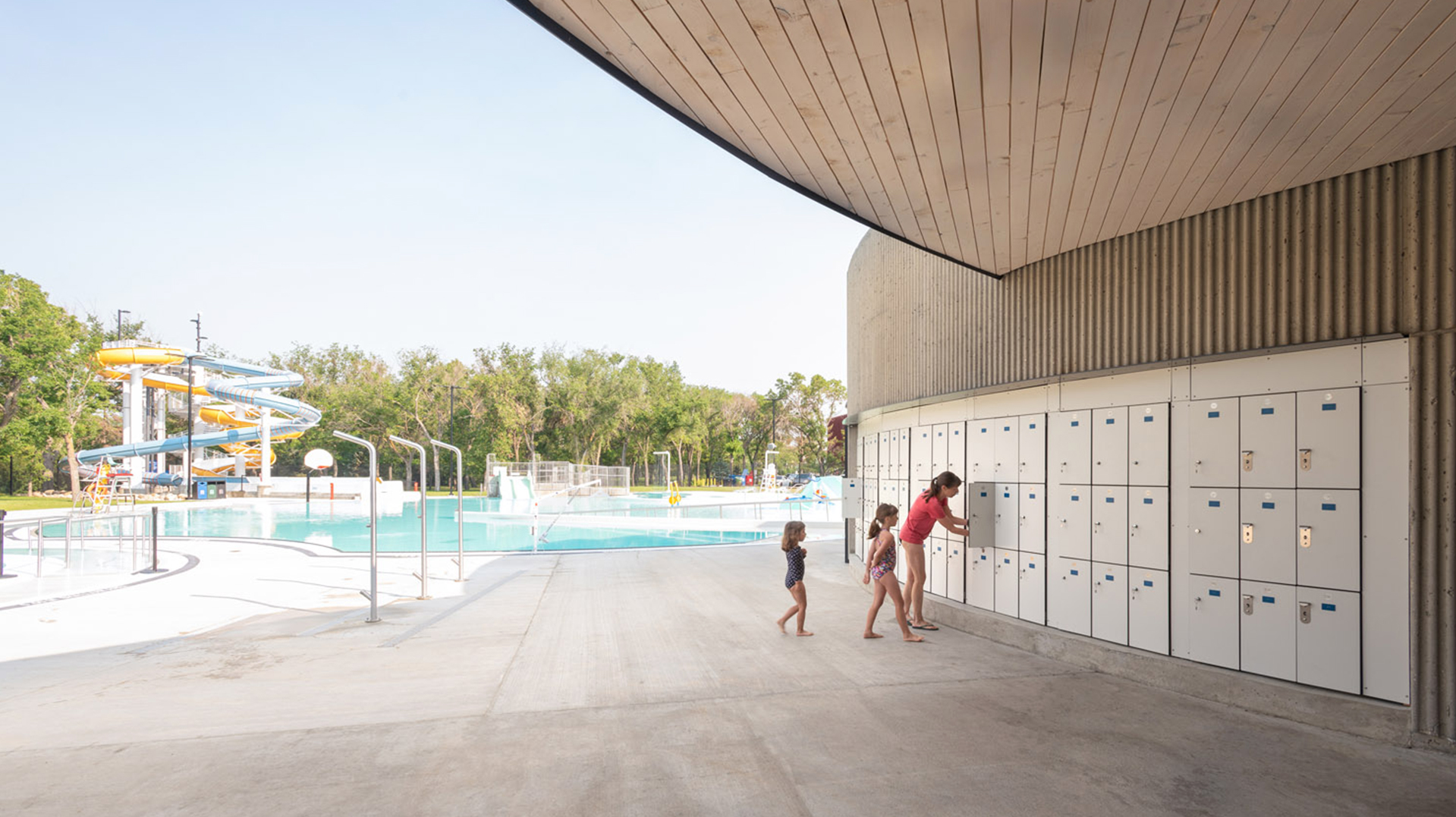 Family at Wascana Pool using the lockers.