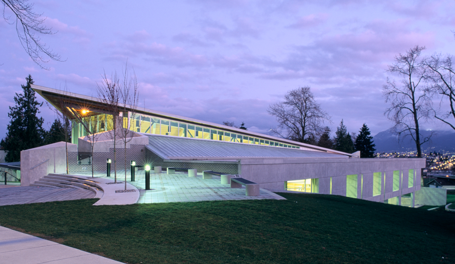 Exterior image of the Renfrew Branch Library shows how the building is nestled into a slope of the site.